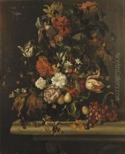 Tulips, Irises, Carnations And Other Flowers In A Glass Vase, Together With Grapes On A Stone Ledge by Ernst Stuven