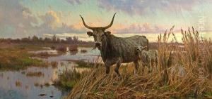A Water Buffalo And Her Calf In A Marshylandscape