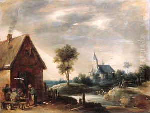 Boors playing at cards outside an inn, a church by a river beyond by Thomas Van Apshoven