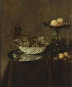 A Still Life With A Wan-li Porcelain Bowl With Grapes On A Pewter Plate, A Silver Tazza With Peaches, Together With Plums And Nuts, All On A Draped Table by Jan Jansz. Treck