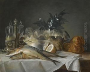 A Still Life Of Mackerel, Glassware, A Loaf Of Breadand Lemons On A Table With A White Cloth