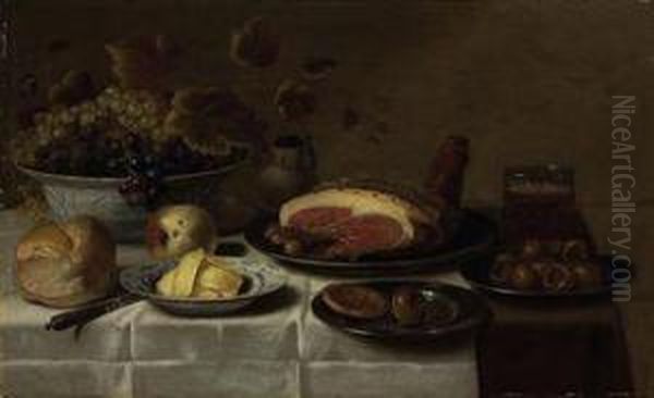 White And Blue Grapes In A 'kraak' Porcelain Bowl, A Loaf Of Bread,a Knife, Butter On A Porcelain Plate, A Biscuit And Medlar On Asilver Plate, A Mug Of Beer, A Joint Of Ham On A Third Silverplate, - view 1