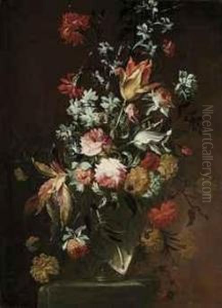 Tulips, Roses, Amaranthus, Carnations And Other Flowers In A Glassvase On A Stone Ledge - view 1