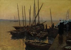 Fishing Boats Along A Pier At Sunset