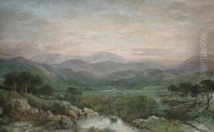 Cattle Grazing In A Mountainous Landscape