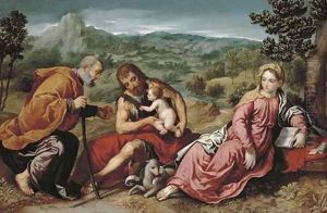 The Holy Family with Saint John the Baptist in an extensive landscape by Paris Bordone