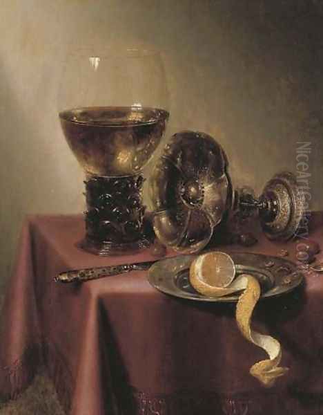 An upturned silver tazza, hazelnuts, a peeled lemon on a pewter platter, a knife and a roemer, on a draped table - view 1