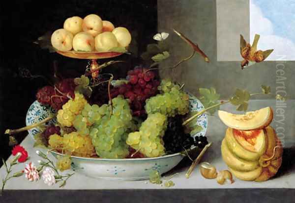 Grapes in a blue and white porcelain bowl with peaches on a gold tazza, with a melon, shells and carnations on a stone ledge - view 1
