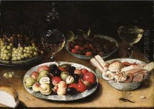 Still Life Of Plums, Nuts And
Apples, Raspberries And Sweetmeats In Three Blue-and-white Porcelain
Bowls, Together With Grapes On A Pewter Dish, A Facon-de-venise by Osias, the Elder Beert