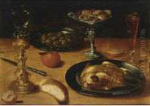 A Still Life With A Roast
Chicken And Olives On Pewter Plates, A Roemer In A Silver-gilt Holder,
An Orange, A Tazza With Cookies, A Wineglass, Together With A Knife And
Bread, All On A Wooden Table by Osias, the Elder Beert