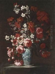 Roses, Peonies, Narcissi And Other Flowers In A Decorated Vase On A Table by Andrea Belvedere
