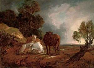 A wooded landscape with cattle