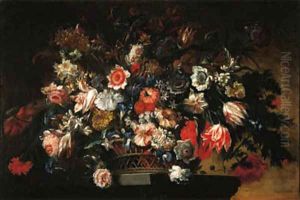 Parrot tulips, carnations, daffodils and other flowers in a basket on a pedestal