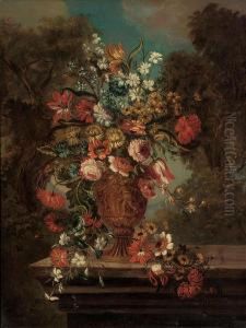 Tulips, Chrysanthemums, 
Convolvulus, Camelias, Clematis And Other Flowers In A Sculpted Urn, On A
 Stone Ledge, In A Landscape