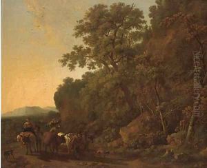 A wooded landscape with a drover and his cattle with other travellers on a track