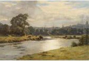 Cattle Grazing On A Riverbank