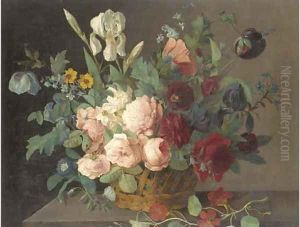 Roses, narcissi, irises, tulips and other flowers in a basket on a stone ledge