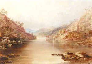 A sailing vessel on a lake in a mountainous landscape