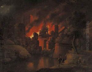 A town on fire at night with onlookers
