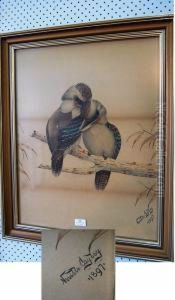 Two Kookaburra's Snuggling On A Branch