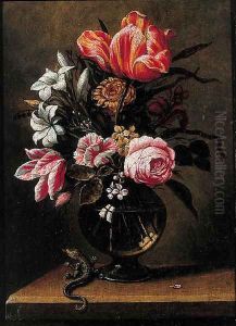 Tulips, roses, carnations and other flowers in a glass vase