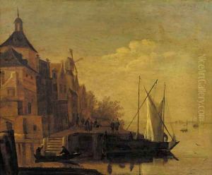A town by a river with sailing vessels moored at a quay, at dusk