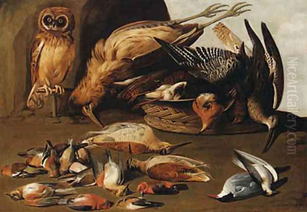 An owl on a perch with dead birds - view 1