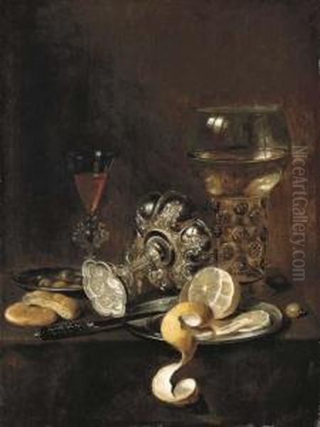 A Giant Roemer, An Upturned
Goblet, A Glass, Bread, A Knife And A Partly-peeled Lemon On A Platter,
On A Table - view 1