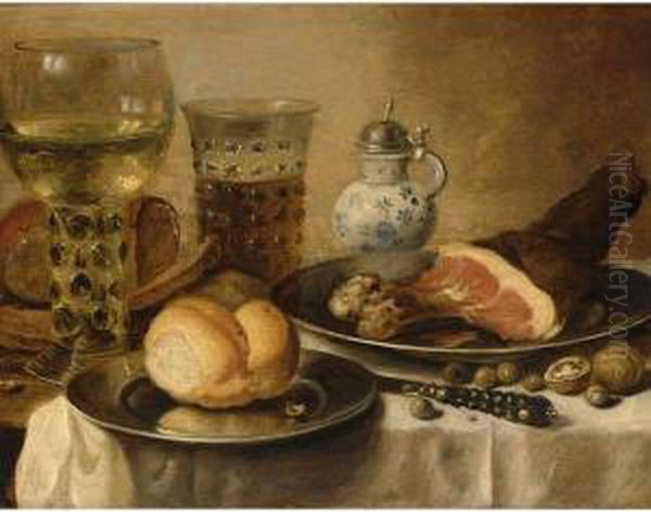 A Still Life Of A Roemer, A Beer
Glass, A Ham And A Bread Roll On Pewter Plates, A Stoneware Jug And A
Knife Together With Walnuts And Hazelnuts, All On A Table Draped With A
White Cloth - view 1