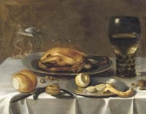 A Roemer Of Wine, A Turkey And A
Partly-peeled Lemon On Pewterdishes, Bread And Hazelnuts On A Draped
Table by Pieter Claesz.