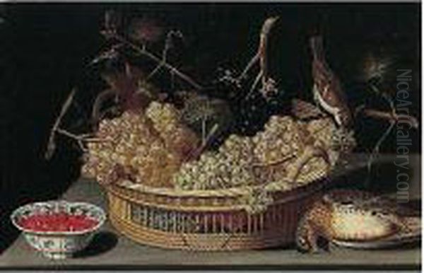 A Still Life Of A Basket Of
Grapes, With A Sparrow And A Thrush And Fraises-de-bois In A
Blue-and-white Porcelain Bowl Upon A Table Top - view 1