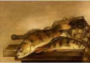 A Still Life Of Sea Breem, A Fishing Basket And Nets Together On A Wooden Table by Pieter de Putter