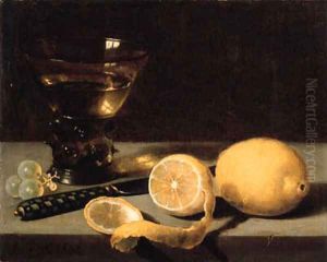 A lemon, a partly peeled lemon, grapes, a roemer and knife on a stone ledge