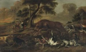 Hounds Attacking A Deer In A Hilly Landscape, A Hunters Couple On Horseback Nearby by Paul de Vos