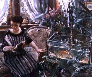 A Woman Reading near a Goldfish Tank
