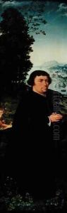 Portrait of a donor kneeling by a river