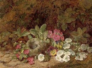 A bird's nest with primulas, pansies and blossom on a mossy bank