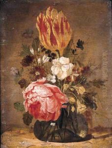 A tulip, a rose, a violet and other flowers in a glass vase on a wooden table by Jacques de Claeuw