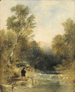 An angler on the bank of a rocky river