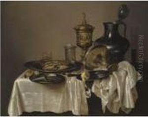 A Monochrome Still Life With A
Silver-gilt Goblet, An Overturnedsilver Tazza, A Pewter Flagon, Glasses
And A Salt Cellar, With Acrab, Oysters, Nuts, A Knife And A Peeled Lemon
On A Table Drapedwith A White Cloth by Willem Claesz. Heda