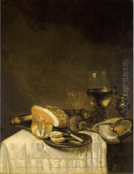 A Still Life With A Nautilus
Cup, A Roemer, A Wineglass, A Ham, Bread And A Knife On Pewter Plates
Together With A Silver Gilt Mustard Jar, All On A Table Draped With A
White Tablecloth - view 1