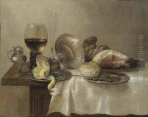 An Upturned Silver Tazza And A Partially Peeled Lemon