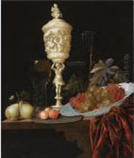 A Still Life With An Ivory
Carved Cup And Cover, A Roemer, Pears, Prunes On A Pewter Plate, Grapes
In A Porcelain Wan-li Bowl, A Flute-glass And A Tazza, All On A Wooden
Ledge Draped With A Red Velvet Cloth - view 1