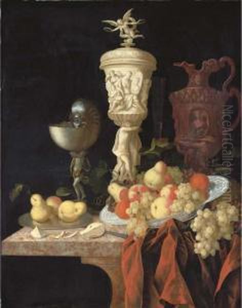 A Nautilus Cup, A Sculpted
Marble Urn, A Sculpted Porphyry Jug Andother Vessels With Oranges - view 1
