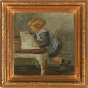 A Child Looking In A Magazine