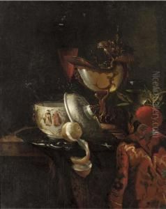 A Nautilus Cup, An Oriental Bowl On A Silver Tray And Glasses Ofwine On A Table by Willem Kalf