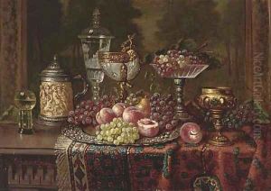 A salver of fruit and various vessels on a draped table by Ernst Czernotzky