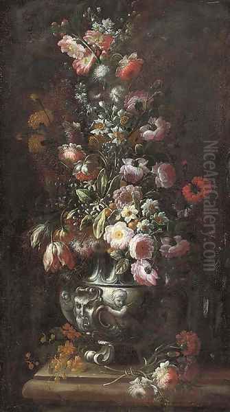 Roses, carnations, tulips, morning glory, narcissi and other flowers in a sculpted urn on a ledge - view 1