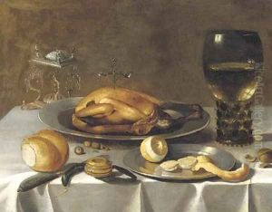 A roemer of wine, a turkey and a partly-peeled lemon on pewter dishes, bread and hazelnuts on a draped table by Pieter Claesz