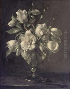 White Camelias In A Glass Vase On A Stone Ledge by Terence Loudon